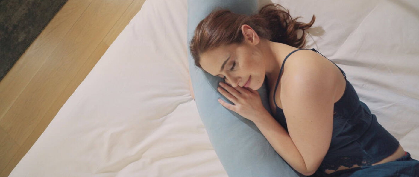 A sleek cosmetic bottle sits inside a pink rectangular box labeled Elegant, with soft shadows creating a clean, premium, and sophisticated product display.