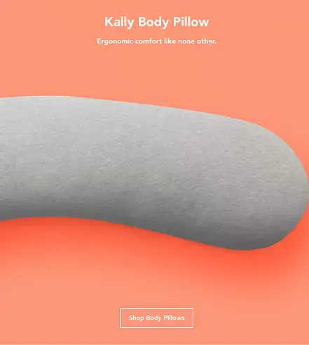 The bottle is positioned diagonally and appears to be balanced on a large, reflective, circular object . The scene is illuminated by warm, orange/amber light, and a fine mist of spray is visible near the top of the bottle.