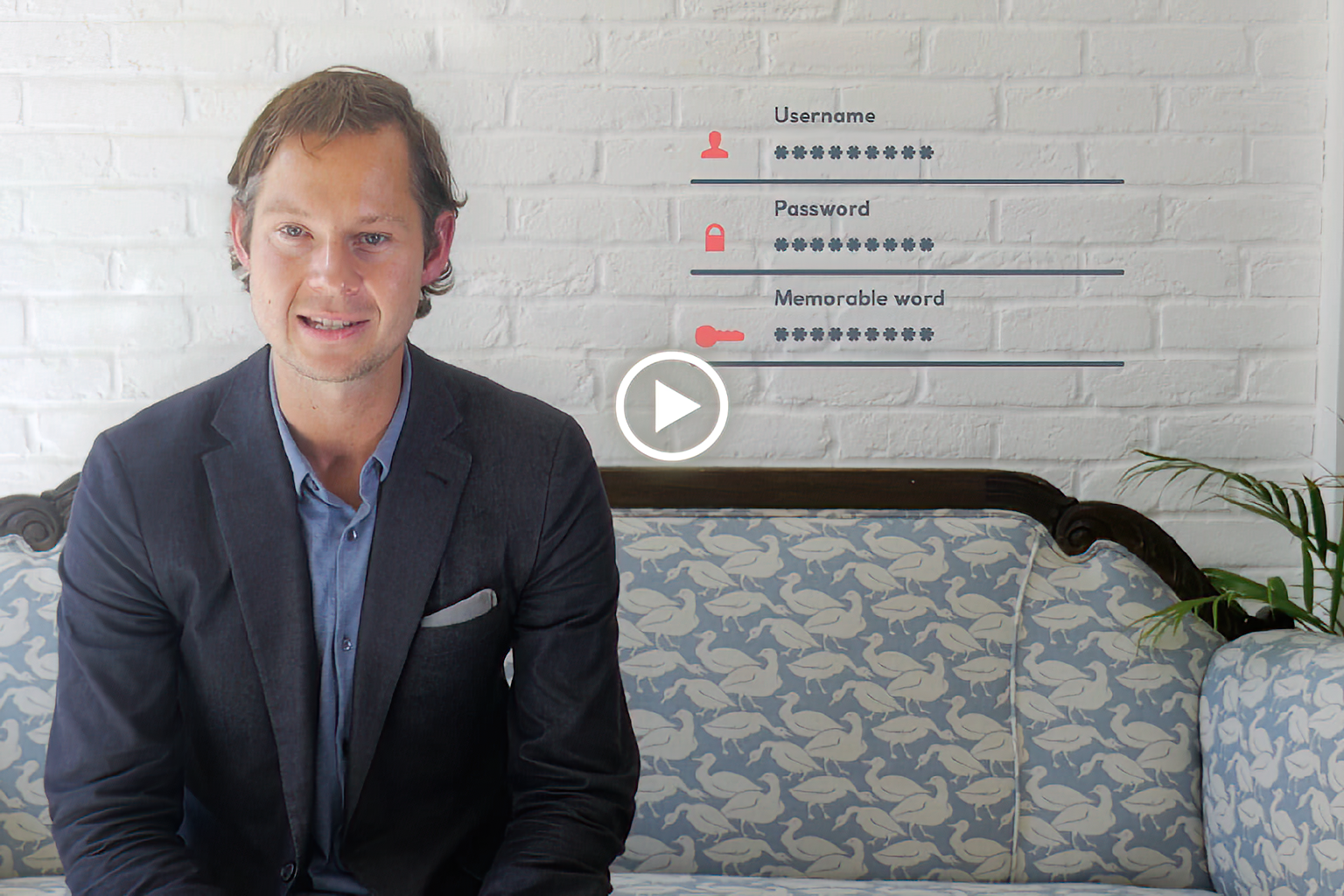 A person wearing a VR headset in a dark room lit with red and blue lights, smiling and reaching forward as if interacting with virtual objects.